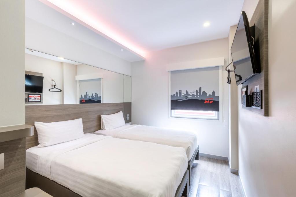 Двухместный (Стандартный двухместный номер с 2 отдельными кроватями) отеля Red Planet Surawong, Бангкок