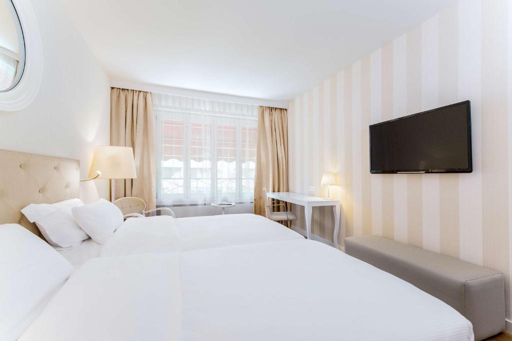 Двухместный (Стандартный двухместный номер с 1 кроватью или 2 отдельными кроватями) отеля NH Geneva City, Женева