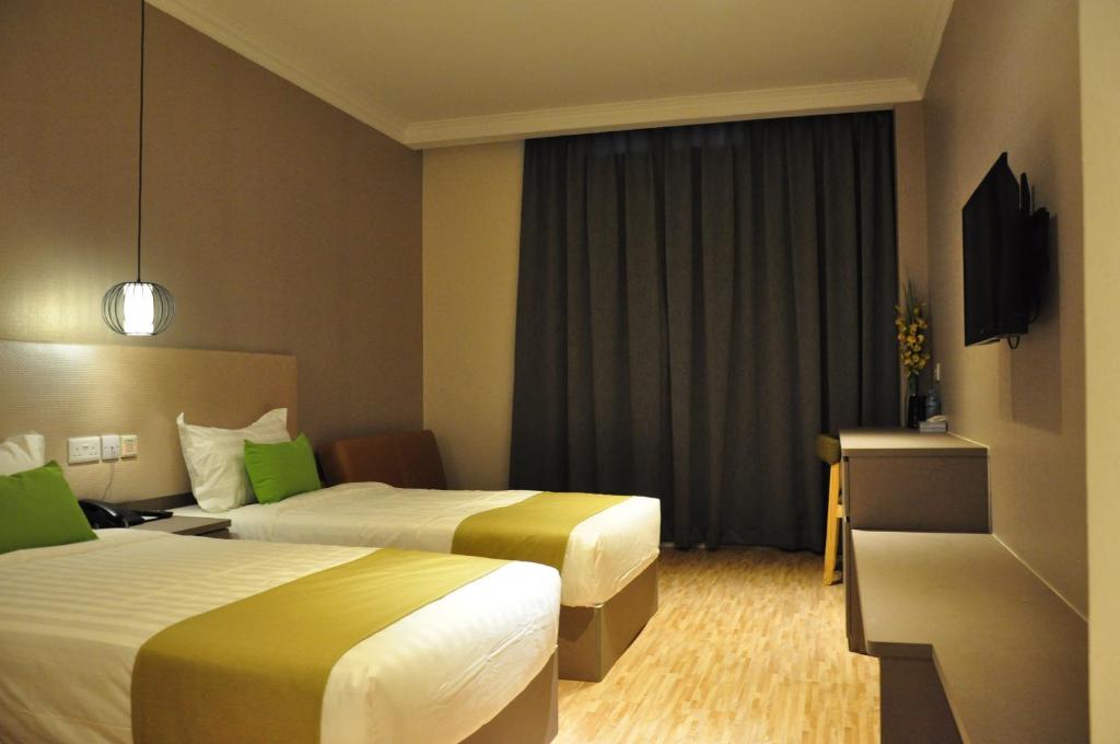 Двухместный (Двухместный номер Делюкс с 2 отдельными кроватями и окном) отеля Champion Hotel, Сингапур (город)