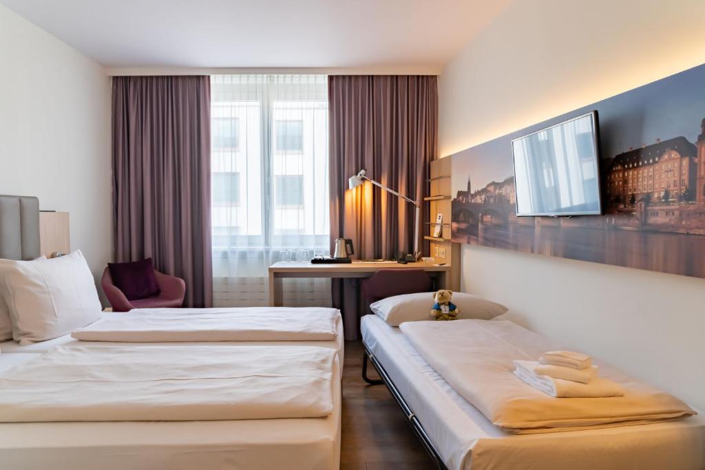 Трехместный (Стандартный трехместный номер) отеля Dorint Hotel Basel, Базель