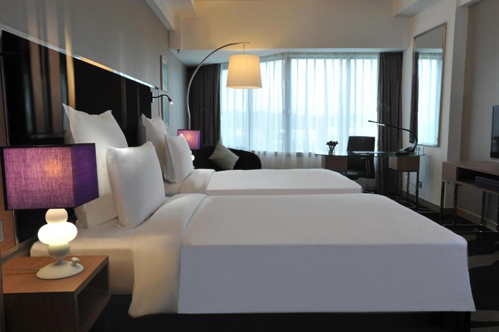 Двухместный (Двухместный номер Делюкс с 2 отдельными кроватями) отеля Pullman Kuala Lumpur Bangsar, Куала-Лумпур