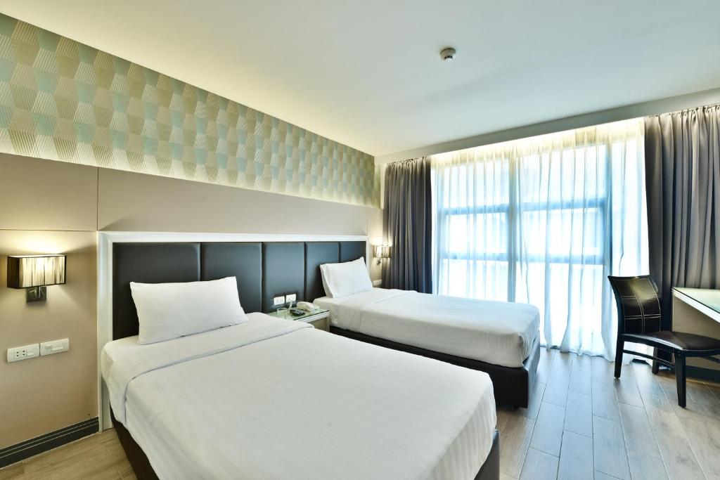 Двухместный (Двухместный номер Делюкс с 2 отдельными кроватями) отеля Prestige Suites, Бангкок