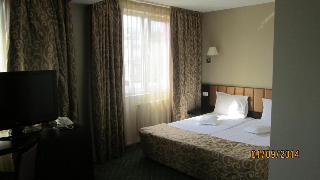 Двухместный (Двухместный номер Делюкс с 1 кроватью или 2 отдельными кроватями) отеля Hotel Bistrita, Бакэу