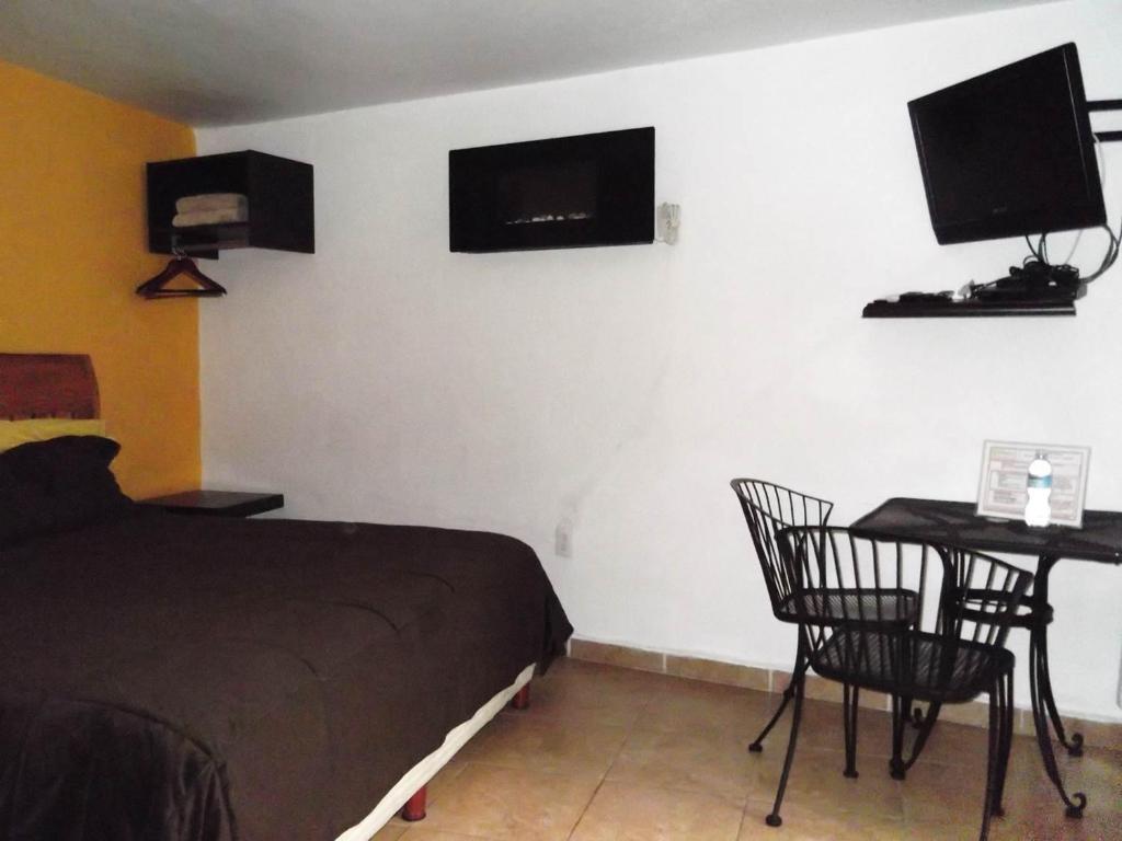 Двухместный (Стандартный двухместный номер с 1 кроватью или 2 отдельными кроватями) отеля Finca Chipitlan Hotel, Куэрнаваки