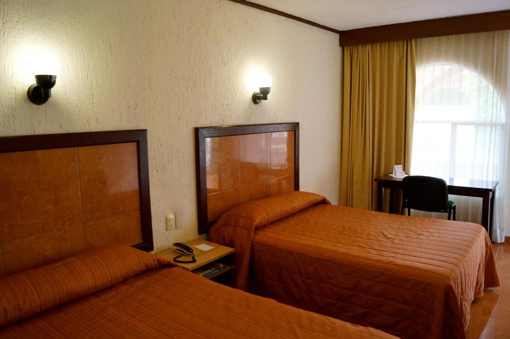 Семейный (Семейный двухместный номер с 1 кроватью) отеля Hotel & Suites Villa del Sol, Морелия