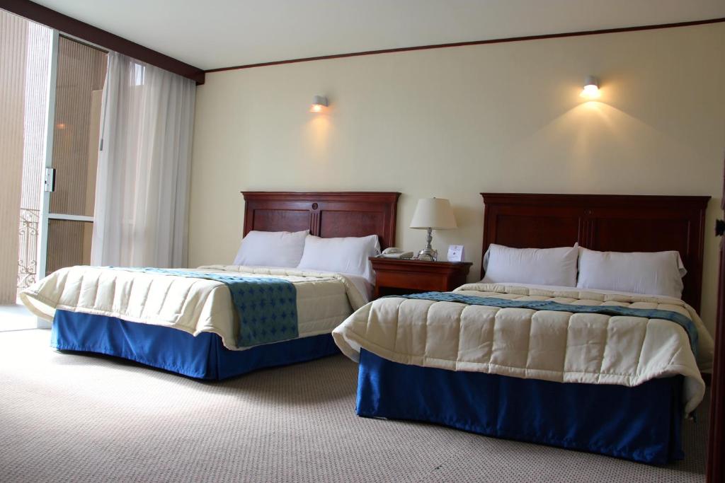 Четырехместный (Двухместный номер с 2 двуспальными кроватями) отеля Hotel Tehuacan Plaza, Теуакан