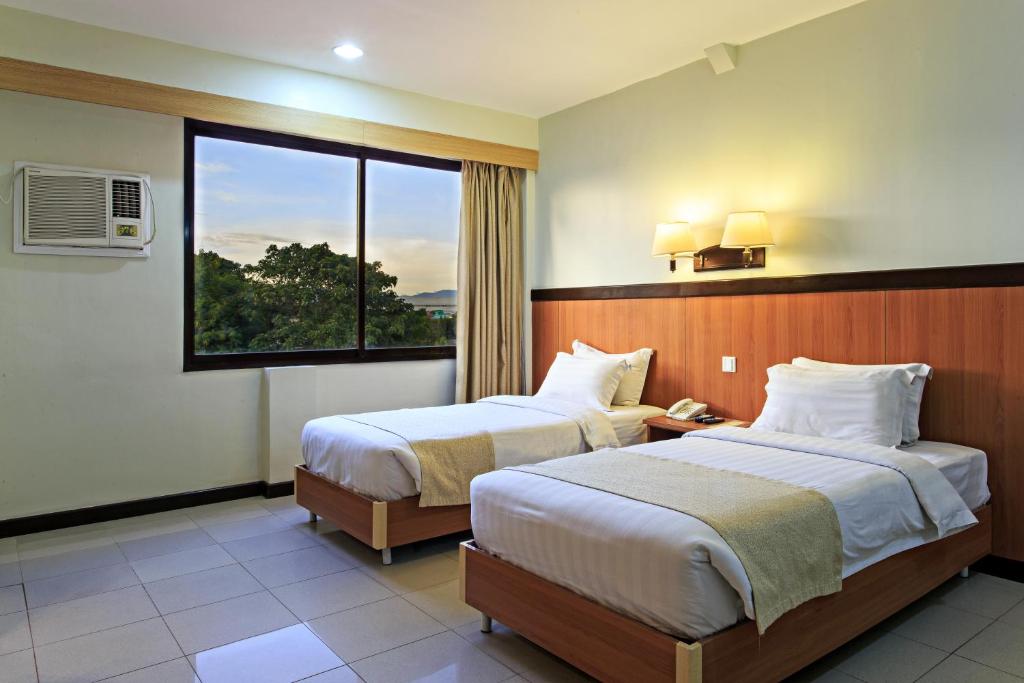 Двухместный (Двухместный номер Делюкс с 1 кроватью или 2 отдельными кроватями) отеля The Orchard Cebu Hotel & Suites, Себу