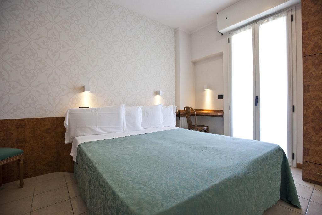 Двухместный (Двухместный номер с 1 кроватью или 2 отдельными кроватями - В дополнительном здании) отеля Hotel Aurora, Римини