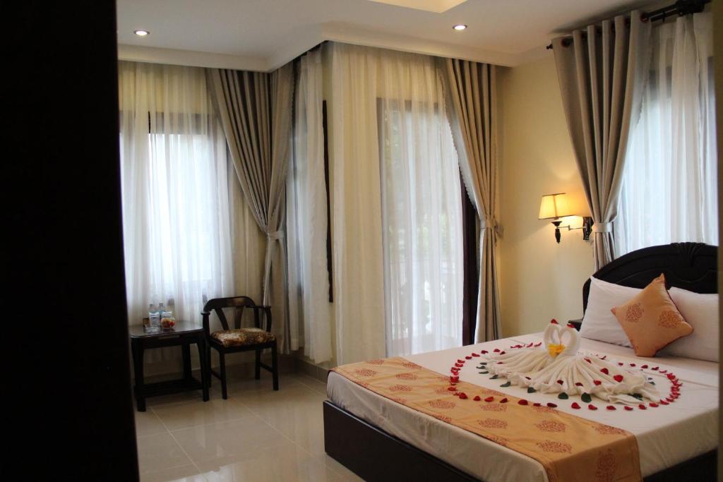 Двухместный (Двухместный номер с 1 кроватью или 2 отдельными кроватями, вид на бассейн) курортного отеля GM Doc Let Beach Resort & Spa, Нячанг