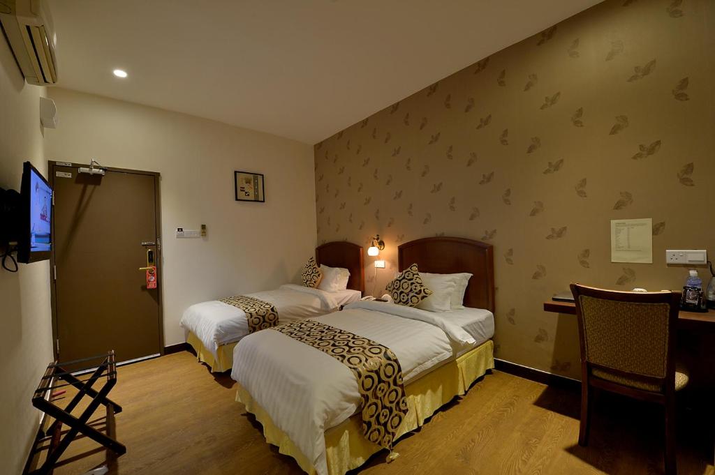 Двухместный (Стандартный двухместный номер без окон с 1 кроватью или 2 отдельными кроватями) отеля Asiana Hotel, Кота-Кинабалу