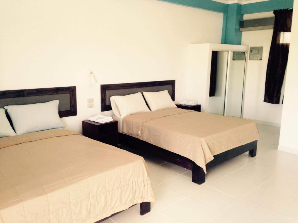 Четырехместный (Стандартный номер с двумя кроватями размера «queen-size») отеля Hotel Plaza Coral, Пунта-Кана