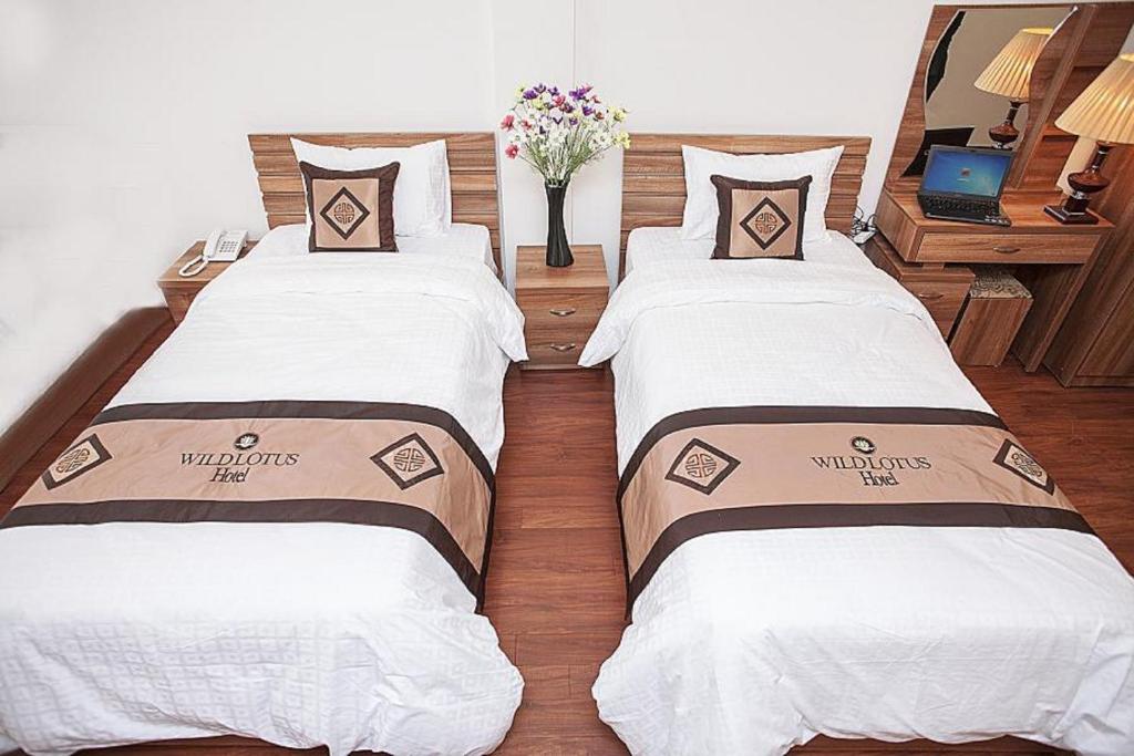 Двухместный (Двухместный номер Делюкс с 1 кроватью или 2 отдельными кроватями) отеля Wild Lotus Hotel - Hoan Kiem, Ханой