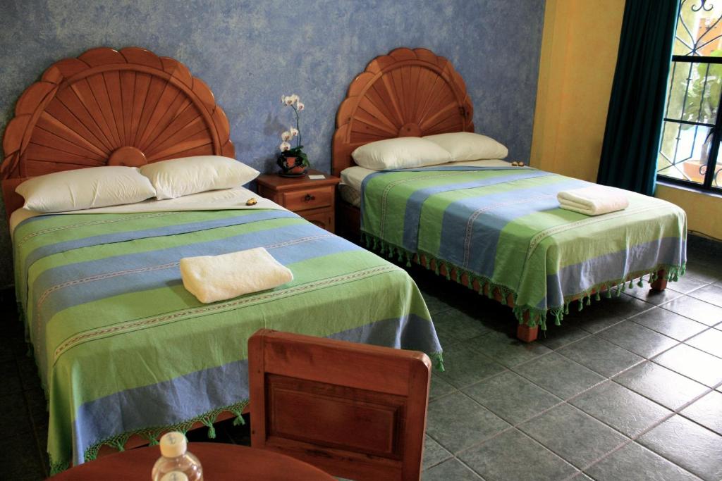 Двухместный (Двухместный номер с 2 двуспальными кроватями) отеля Hotel Oaxtepec, Оастепек
