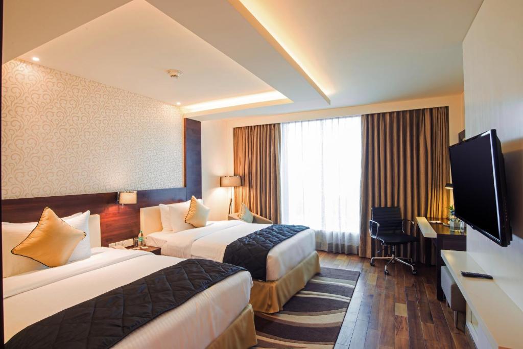 Двухместный (Представительский клубный двухместный номер с 2 отдельными кроватями) отеля Howard Johnson Bengaluru Hebbal, Бангалор