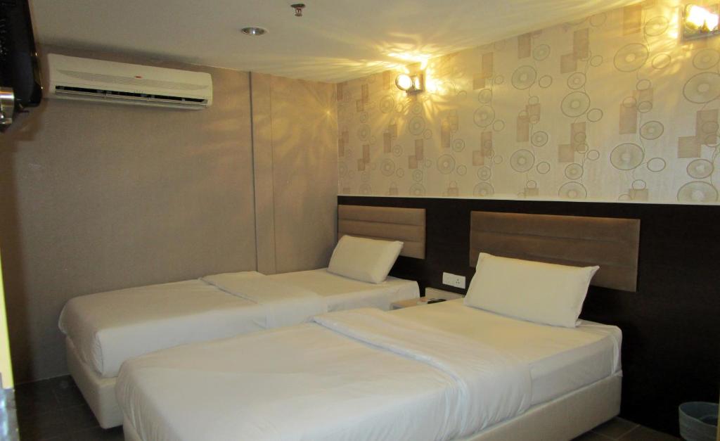 Двухместный (Улучшенный двухместный номер с 2 отдельными кроватями) отеля T-Hotel Bukit Bintang, Куала-Лумпур