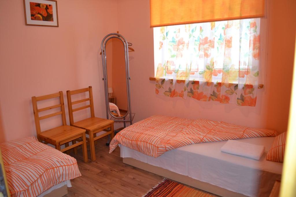 Двухместный (Двухместный номер с 2 отдельными кроватями и общей ванной комнатой) гостевого дома Guest House Magones, Даугавпилс