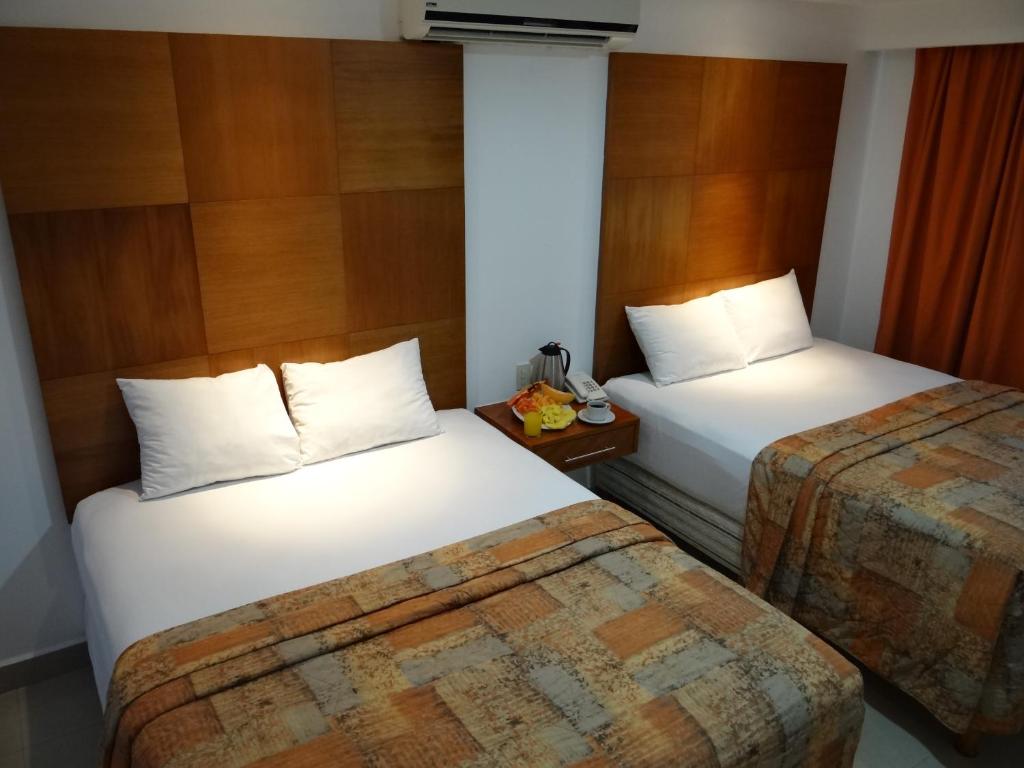 Двухместный (Улучшенный двухместный номер с 2 двуспальными кроватями) отеля Hotel Suites Gaby, Канкун