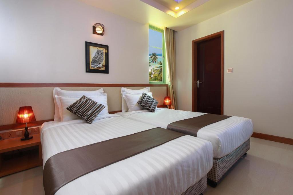 Двухместный (Улучшенный двухместный номер с 1 кроватью, предоставляется трансфер в обе стороны) гостевого дома Season Holidays at Hulhumale, Хулхумале