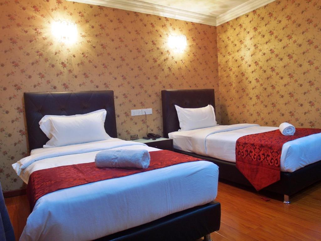 Двухместный (Улучшенный двухместный номер с 2 отдельными кроватями) отеля Classic Kinabalu Hotel, Кота-Кинабалу