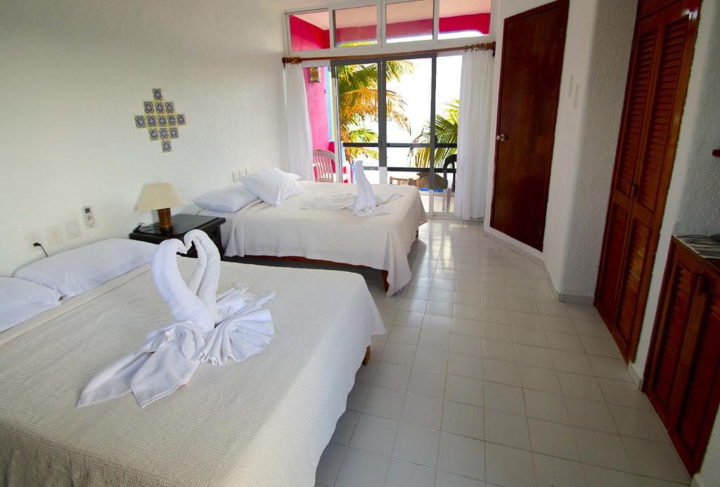 Двухместный (Классический двухместный номер с 1 кроватью и видом на море) отеля Del Sol Beachfront, Акумаль