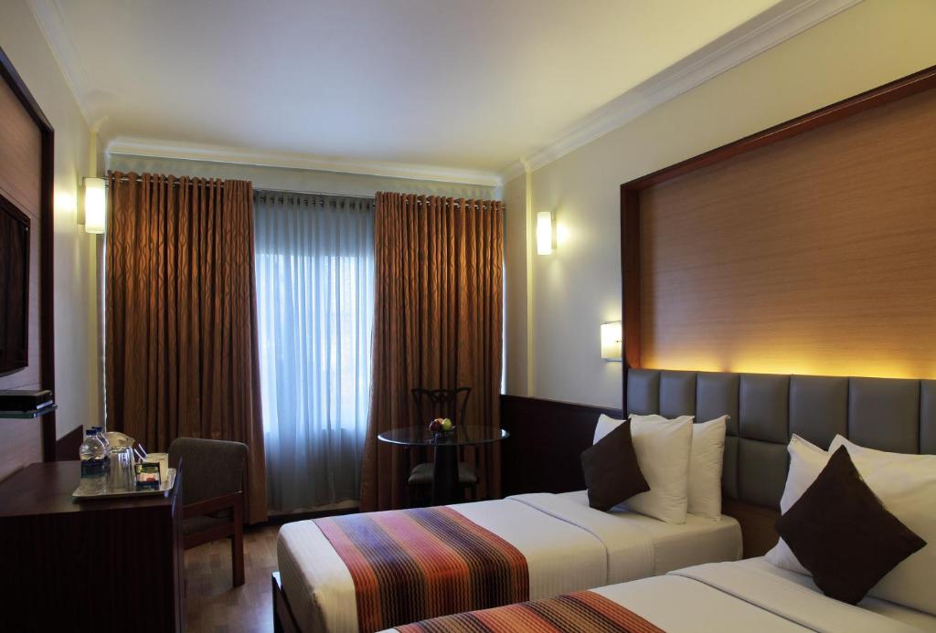 Двухместный (Стандартный двухместный номер с 2 отдельными кроватями) отеля Regency Hotel, Мумбай