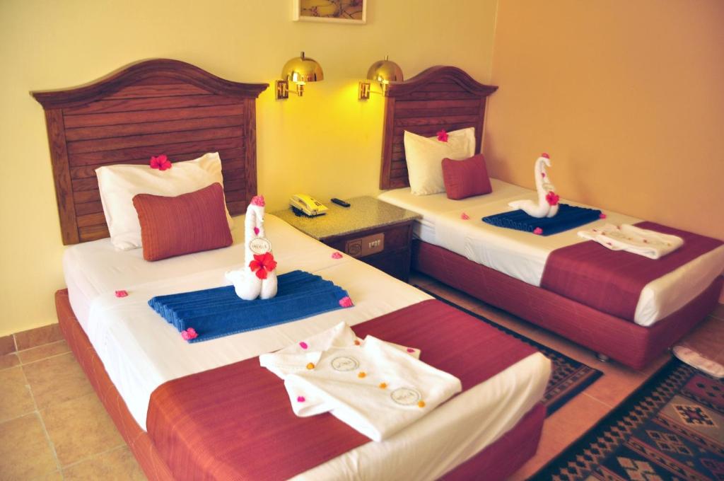 Двухместный (Стандартный двухместный номер с 2 отдельными кроватями и видом на сад) курортного отеля Aladdin Beach Resort, Хургада