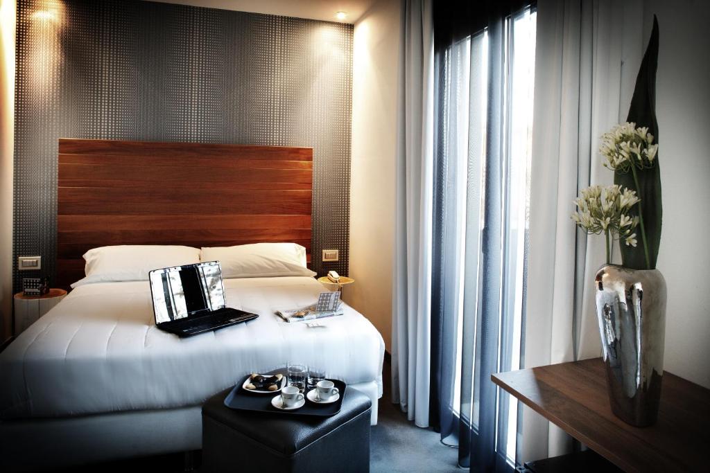 Двухместный (Улучшенный двухместный номер с 1 кроватью или 2 отдельными кроватями и доступом в спа-центр) отеля Q Hotel, Римини