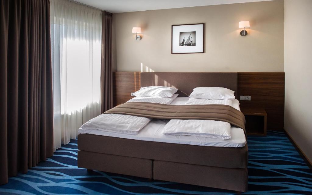 Двухместный (Улучшенный двухместный номер с 1 кроватью) отеля Hotel Porto, Плунге