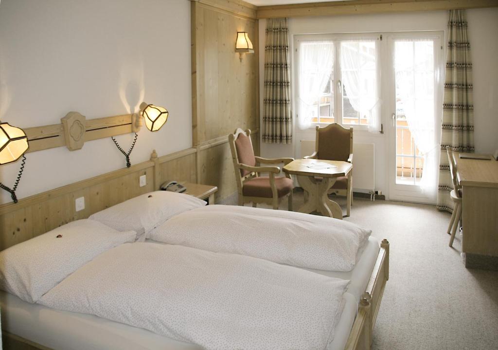 Двухместный (Двухместный номер с 1 кроватью или 2 отдельными кроватями) отеля Hotel Alte Post, Гриндельвальд