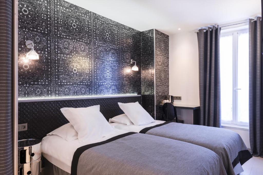 Двухместный (Улучшенный двухместный номер с 2 отдельными кроватями) отеля Hotel Moderne St Germain, Париж