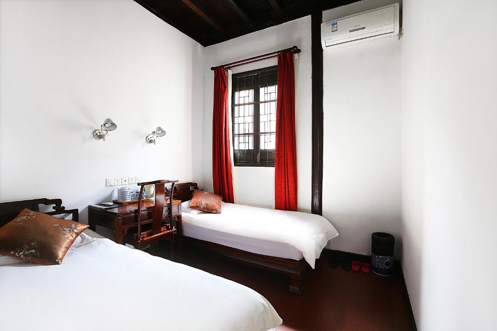 Двухместный (Стандартный двухместный номер с 2 отдельными кроватями) хостела Mingtown Suzhou Youth Hostel, Сучжоу