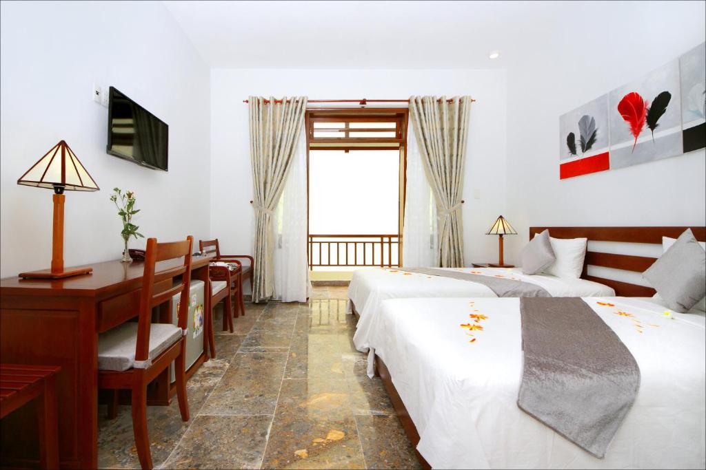 Двухместный (Двухместный номер Делюкс высокого класса с 1 кроватью или 2 отдельными кроватями) виллы Hoi An TNT Villa, Хойан