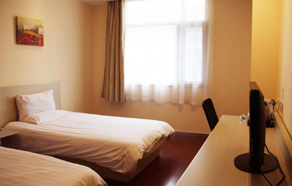 Двухместный (Двухместный номер с 2 отдельными кроватями) отеля Hanting Hotel Xi'an NPU 2nd Branch, Сиань