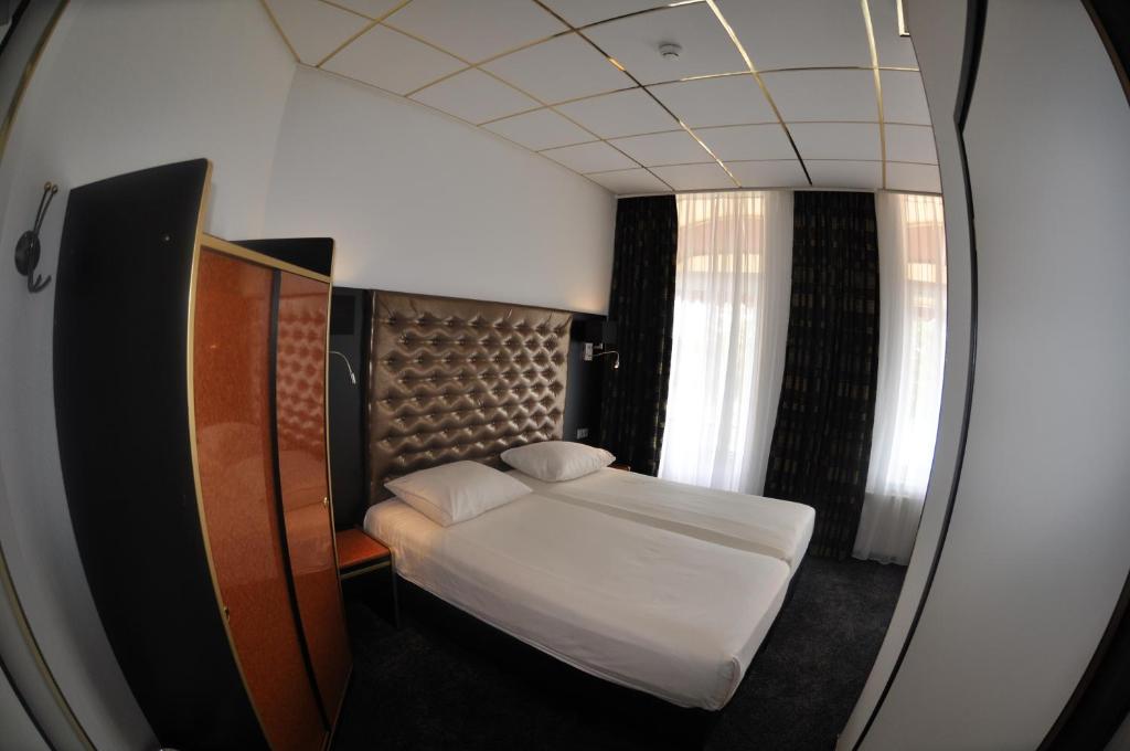 Двухместный (Улучшенный двухместный номер с 2 отдельными кроватями) отеля Hotel Le Beau Rivage, Мидделбург