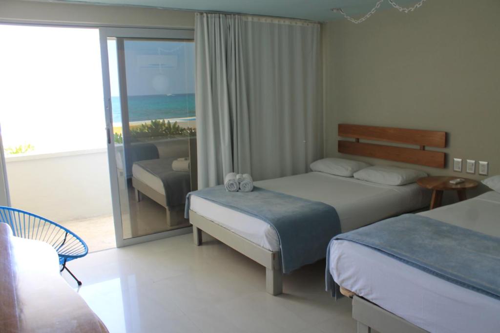 Двухместный (Двухместный номер с видом на море - Первый этаж) отеля Hotel Rocamar, Исла-Мухерес