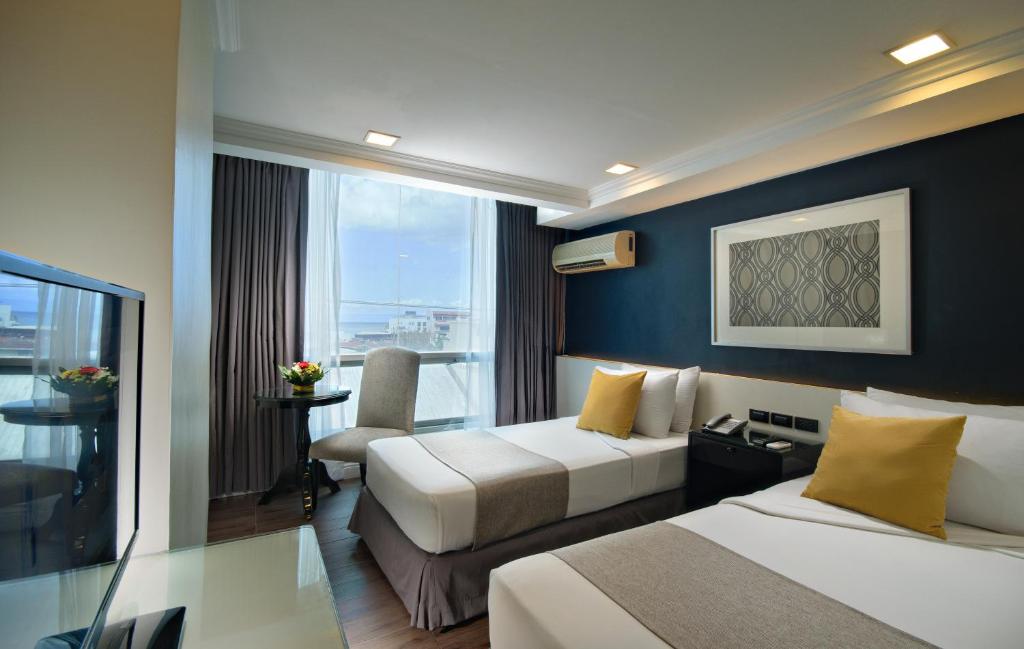 Двухместный (Улучшенный двухместный номер с 2 отдельными кроватями) отеля MetroCentre Hotel, Панглао