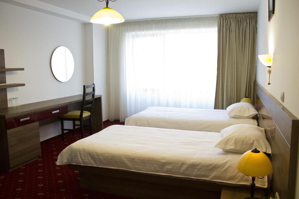 Двухместный (Стандартный двухместный номер с 2 отдельными кроватями) отеля Hotel City Ploiesti, Плоешти