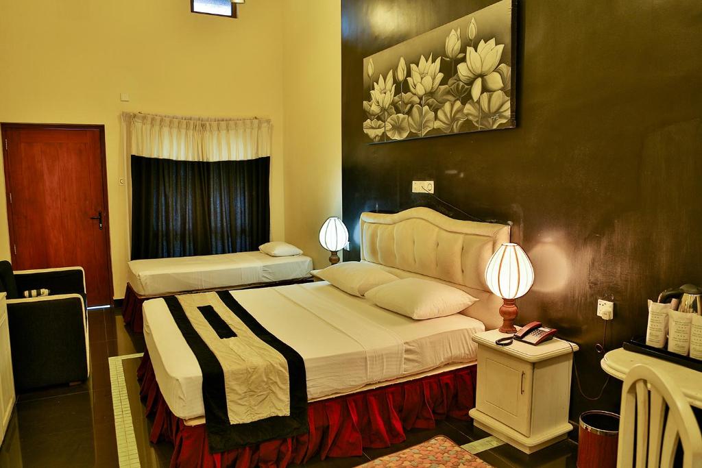 Трехместный (Трехместный номер Делюкс) отеля Miridiya Lake Resort, Анурадхапура
