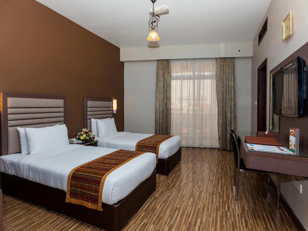 Двухместный (Стандартный двухместный номер с 1 кроватью или 2 отдельными кроватями) отеля Florida International Hotel, Дубай