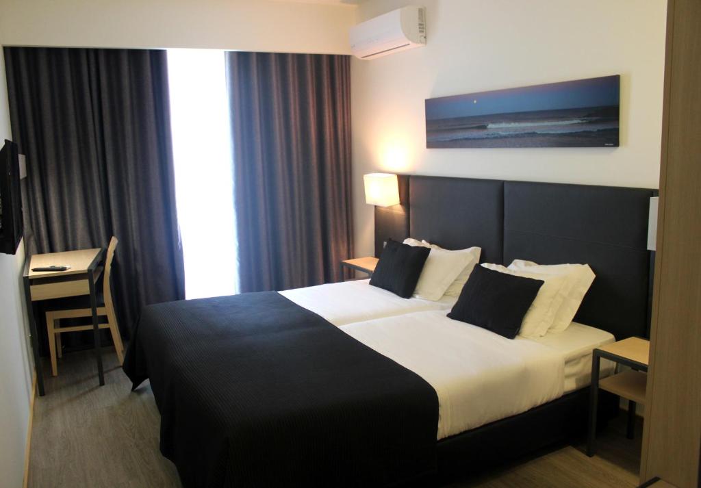 Двухместный (Стандартный двухместный номер с 2 отдельными кроватями) отеля Hotel M, Эшпинью