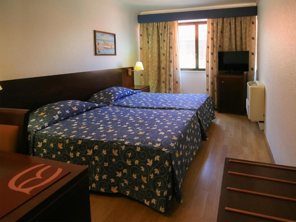 Двухместный (Двухместный номер с 2 отдельными кроватями) отеля Albergaria Quim Barreiros, Вила-Прайа-де-Анкора