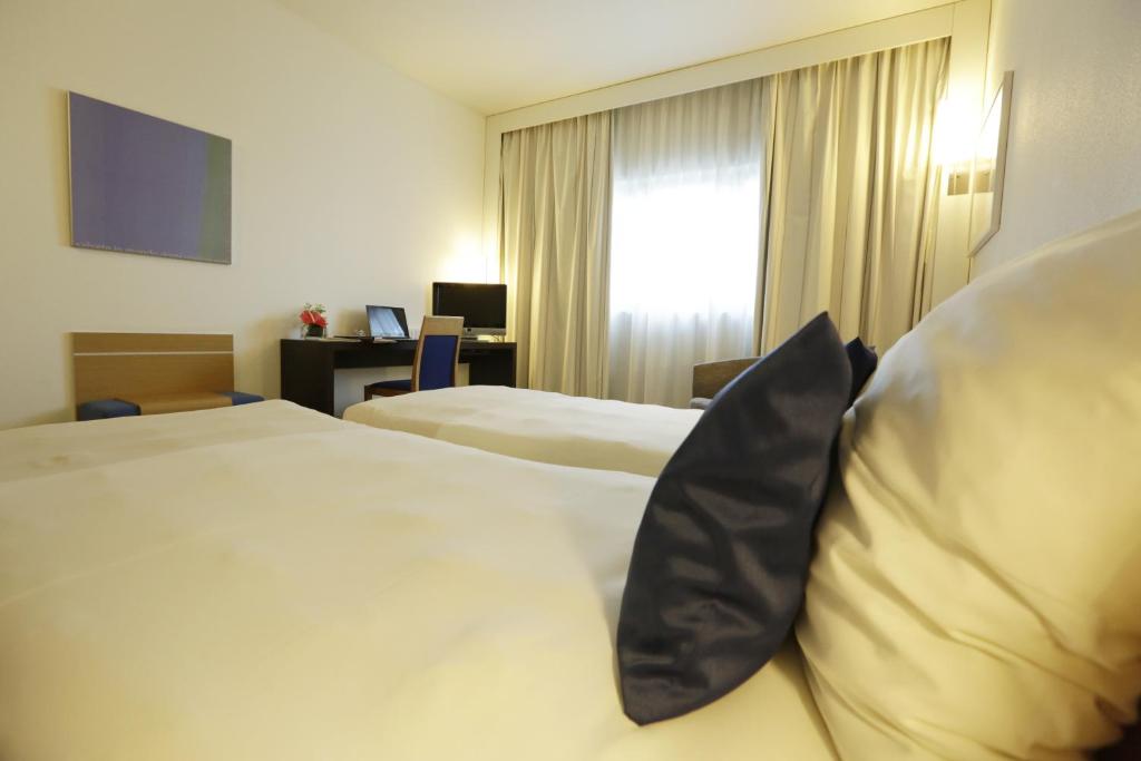 Двухместный (Улучшенный двухместный номер с 2 отдельными кроватями) отеля Novotel Bologna Fiera, Болонья