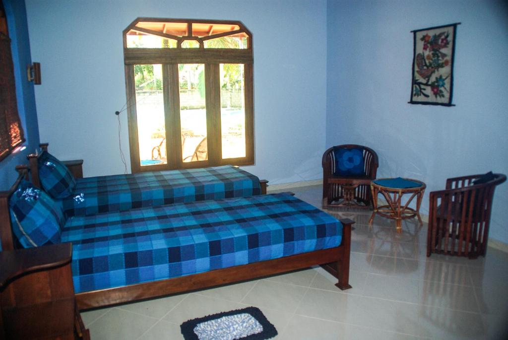 Двухместный (Двухместный номер Делюкс с 1 кроватью (для 2 взрослых и 1 ребенка)) отеля King Coconut Lodge, Габарадува