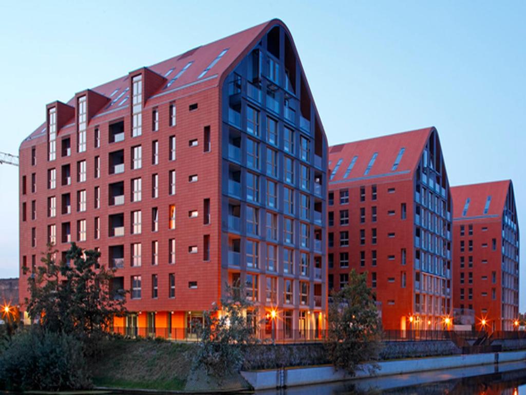 Флатинфо. Szafarnia Gdansk. Гданьская 15. Грано фасад отель Гданьска фото.