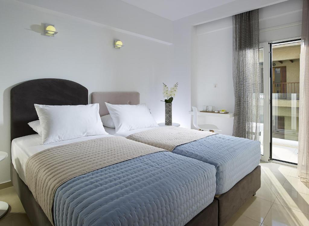 Двухместный (Двухместный номер с 1 кроватью или 2 отдельными кроватями, вид на город) отеля Coral Boutique Hotel, Иерапетра