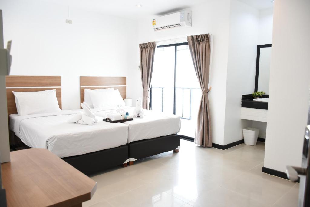 Двухместный (Улучшенный двухместный номер с 1 кроватью или 2 отдельными кроватями) отеля Basaya Laemchabang, Чонбури