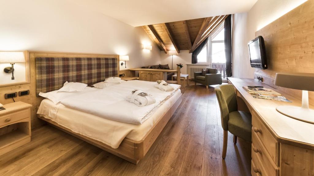 Двухместный (Улучшенный двухместный номер с 1 кроватью или 2 отдельными кроватями) отеля Hotel Genziana, Ортизеи