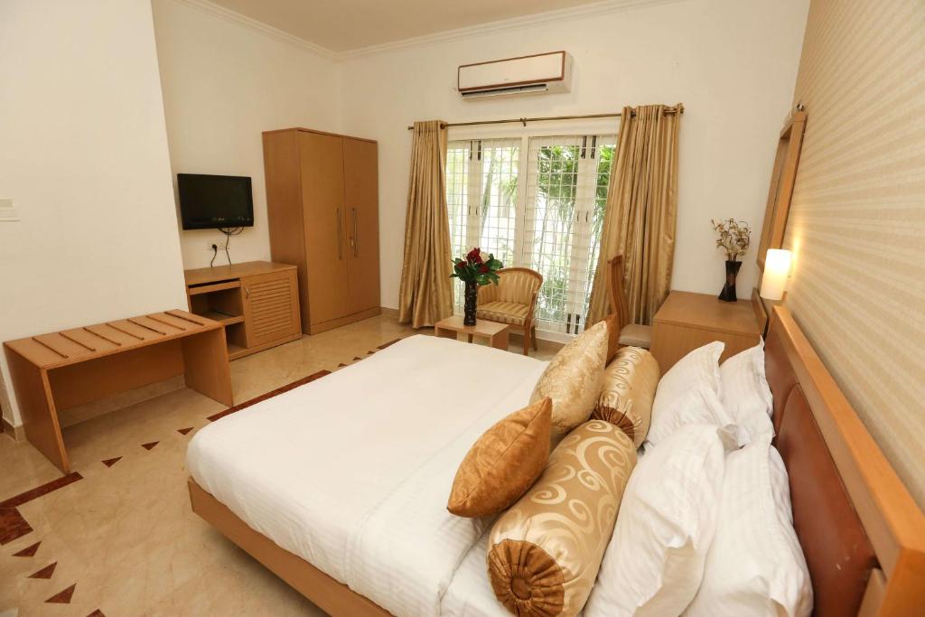 Двухместный (Улучшенный двухместный номер с 1 кроватью) отеля Avenue 11 Boutique Residences, Poes Garden Chennai, Ченнаи