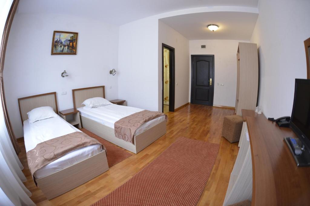 Двухместный (Двухместный номер с 1 кроватью или 2 отдельными кроватями) отеля Hotel Posada, Рымнику-Вылча