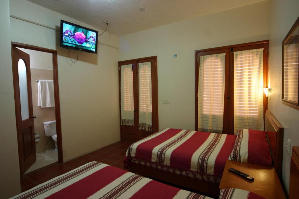 Двухместный (Двухместный номер с 2 двуспальными кроватями) отеля Hotel Oaxaca Mágico, Оахака-де-Хуарес